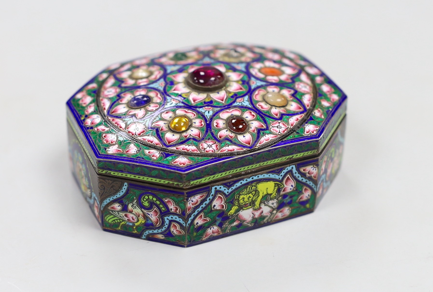 An early 20th century Indian gem set and enamelled gilt white metal trinket box, 10cm long